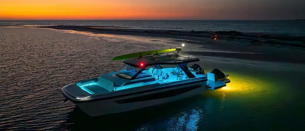 Aquila 45 Sport with its lights on at dusk
