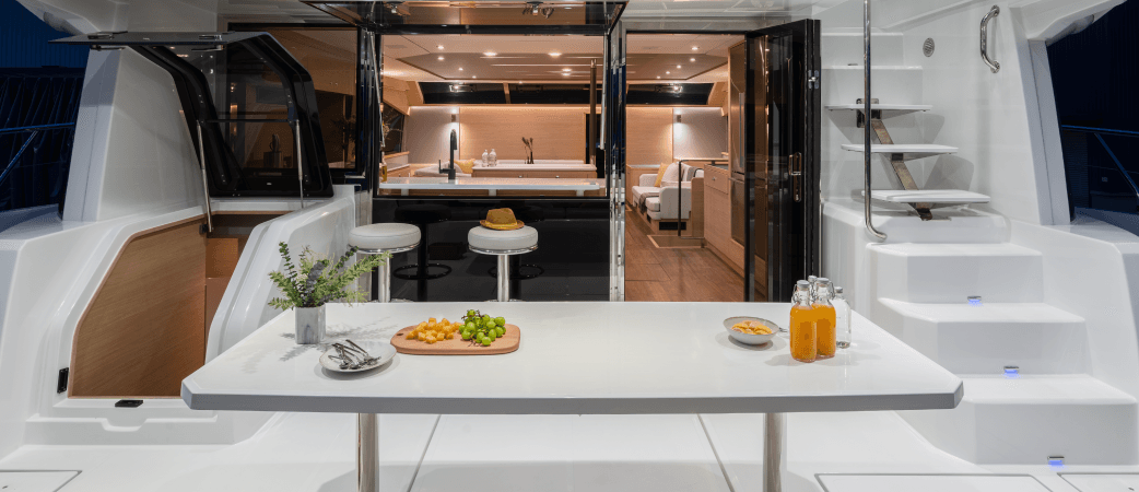 Outdoor dining table on the Aquila 54 Yacht