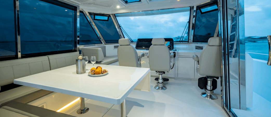 Interior helm and dining area of the Aquila 54 Yacht