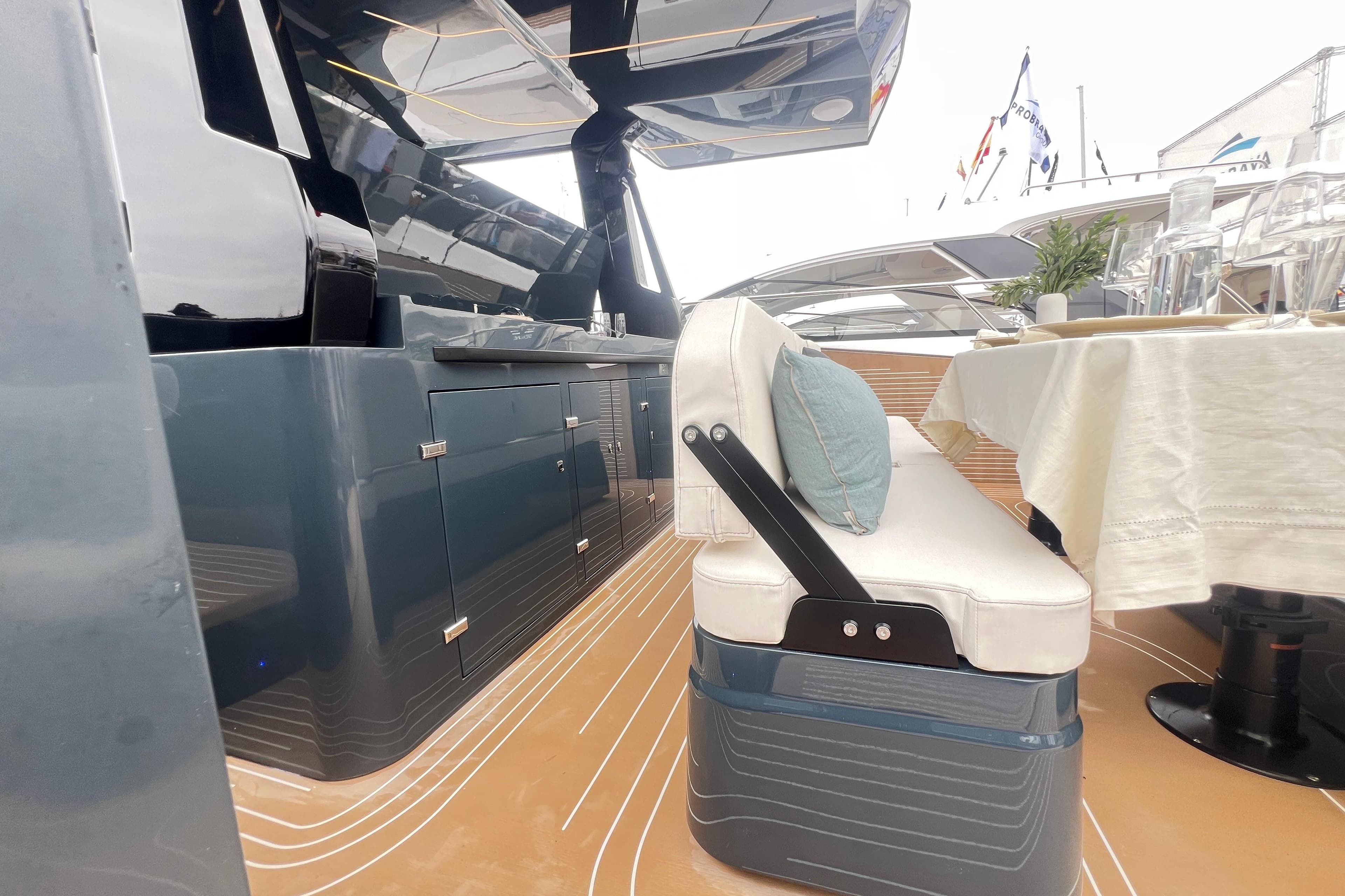Luxurious 2026 Kumbra 43 yacht interior with sleek cabinetry and elegant dining setup.