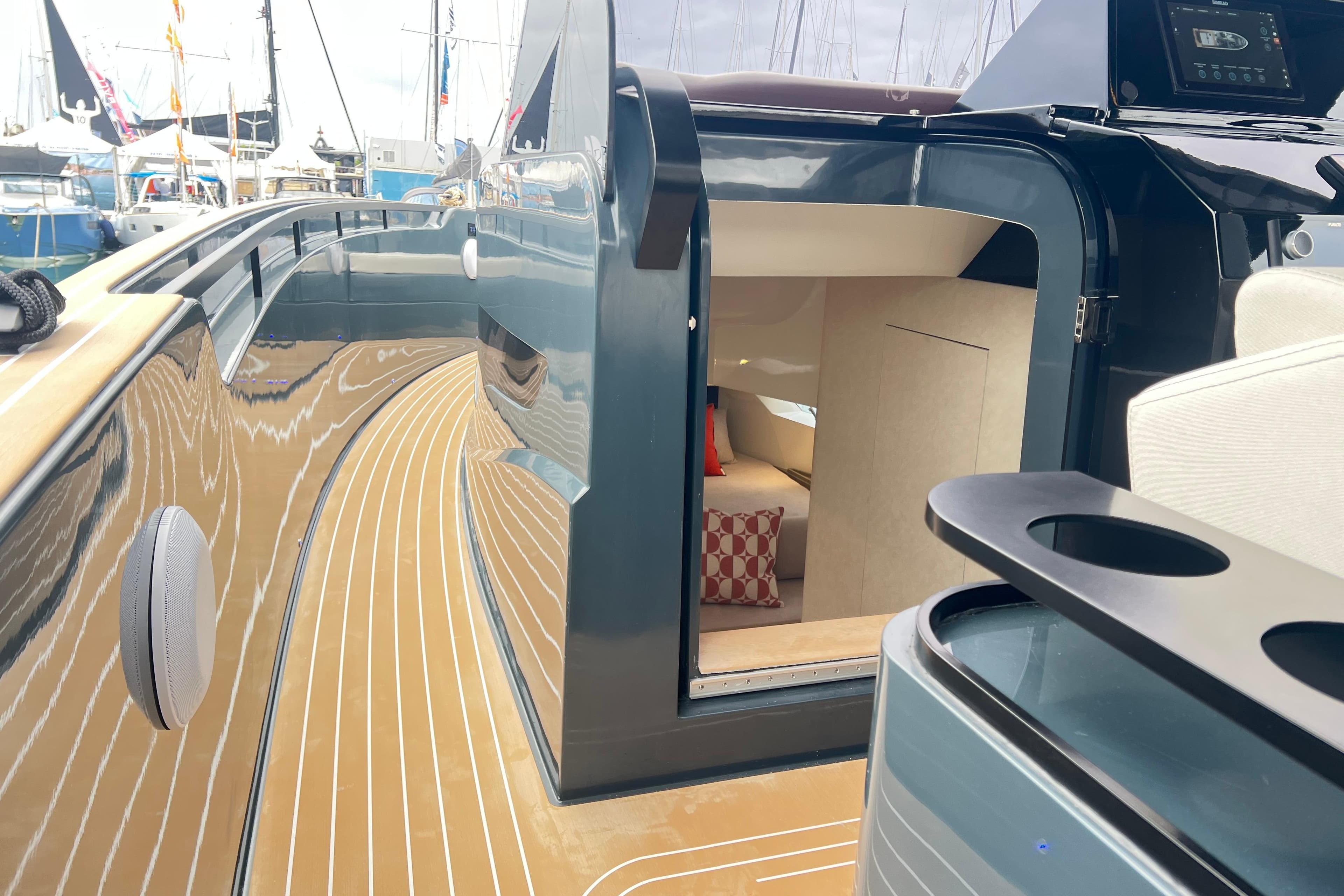 Luxury yacht Kumbra 43 (2026) with sleek deck and cozy cabin interior.