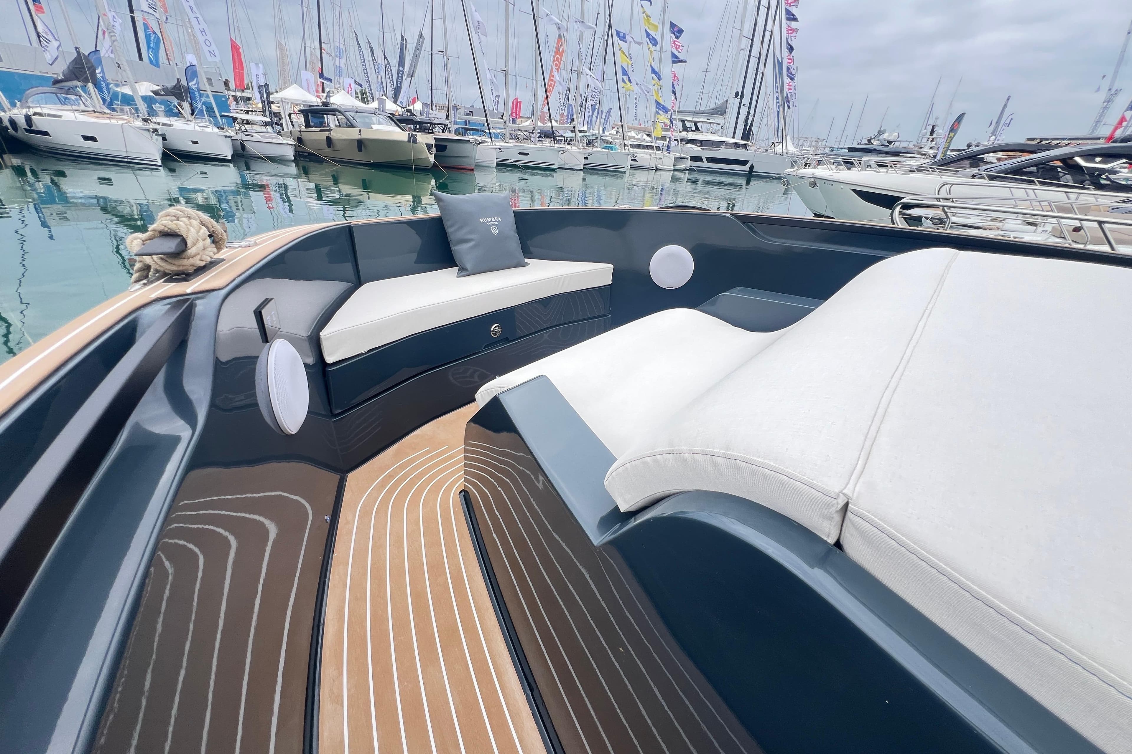 Luxurious Kumbra 43 yacht interior, 2026 model, with elegant seating and marina view.