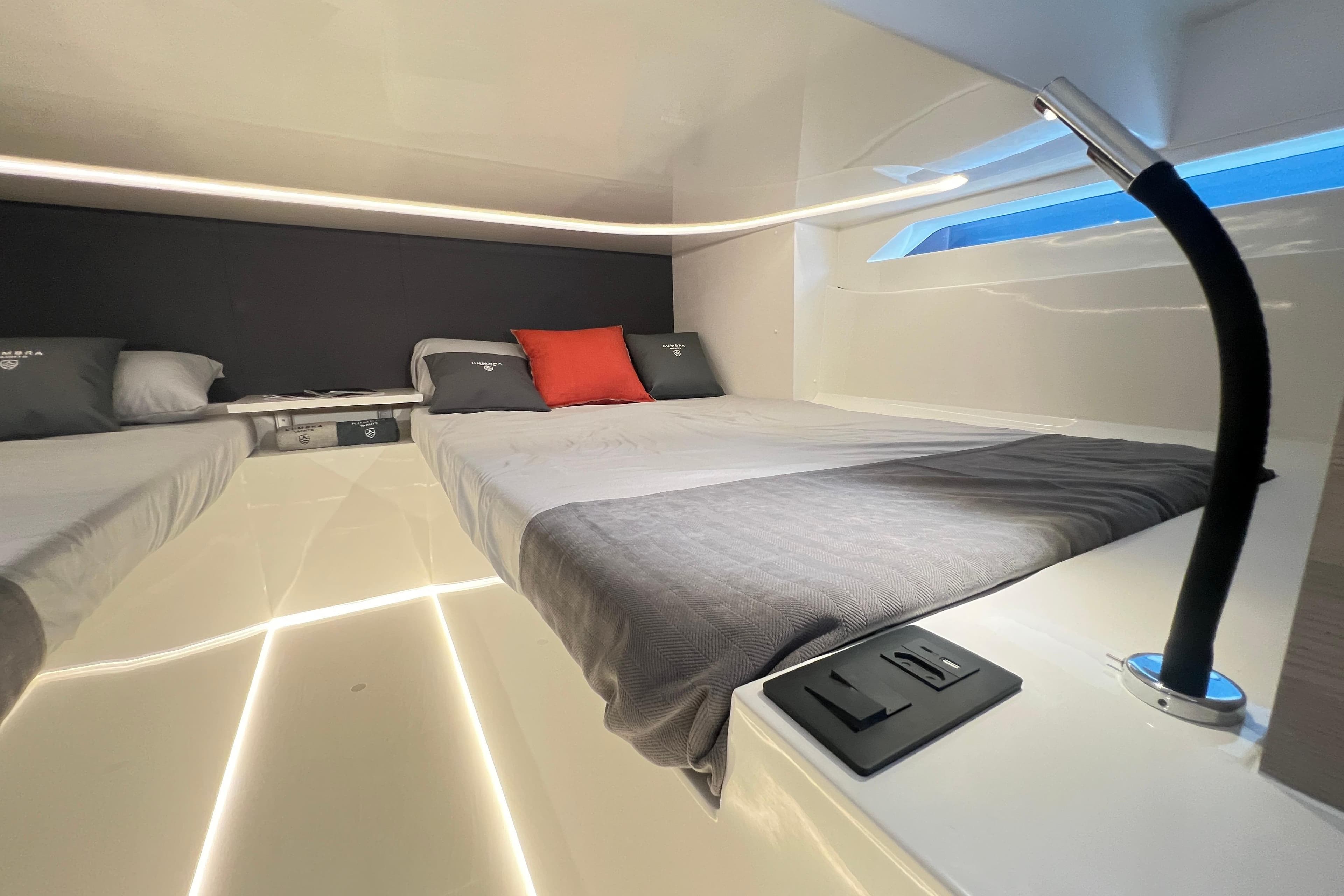 Modern cabin interior of 2026 Kumbra 43 yacht with sleek design and ambient lighting.