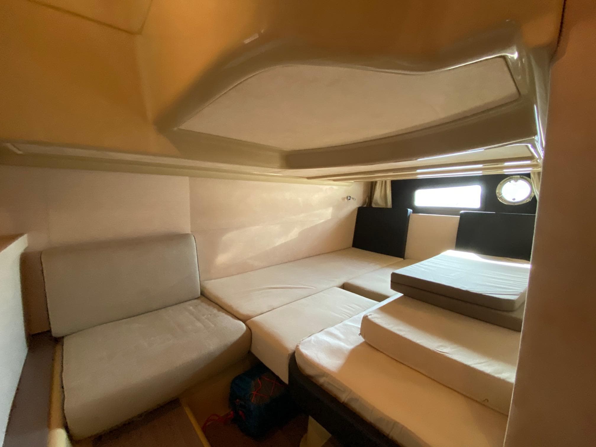 Interior cabin of 2012 Cranchi M38 yacht with comfortable seating and bedding.