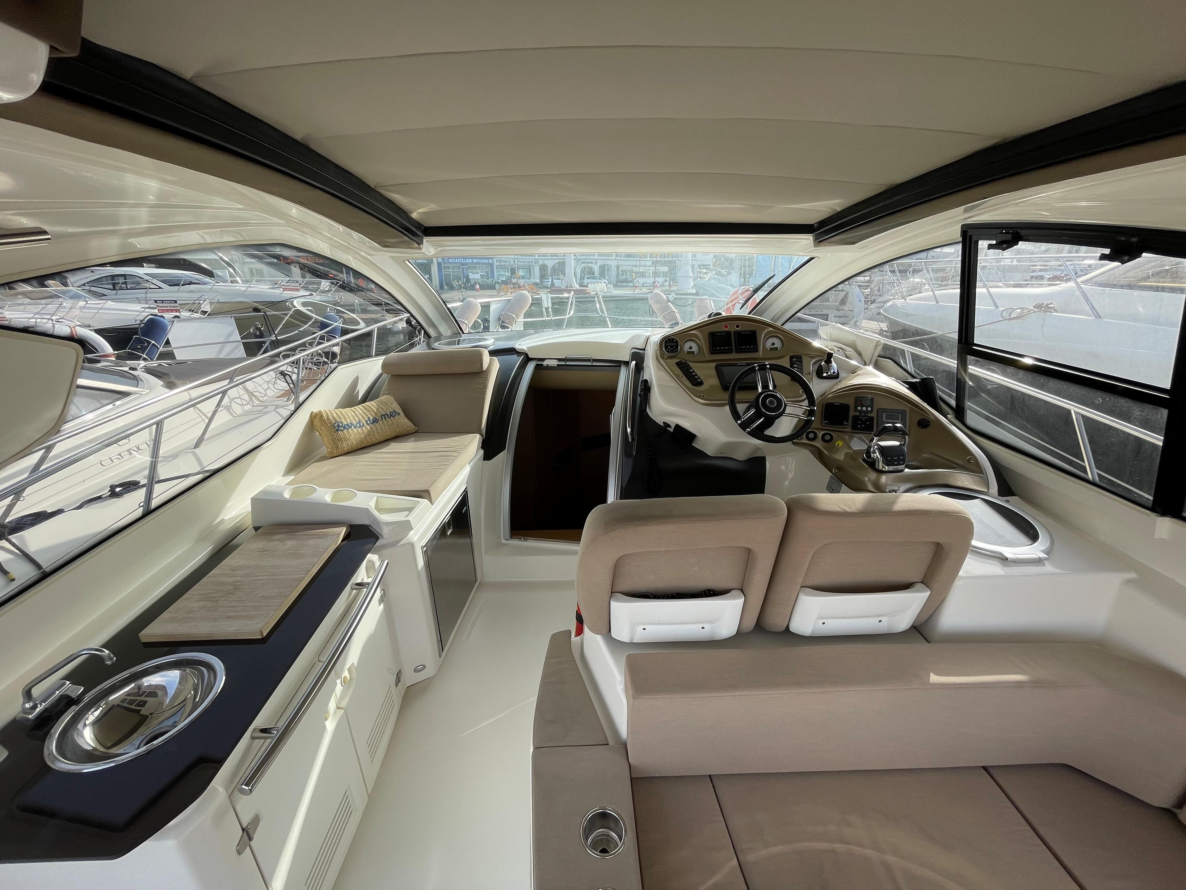 Interior of 2012 Cranchi M38 yacht with modern helm and seating area.