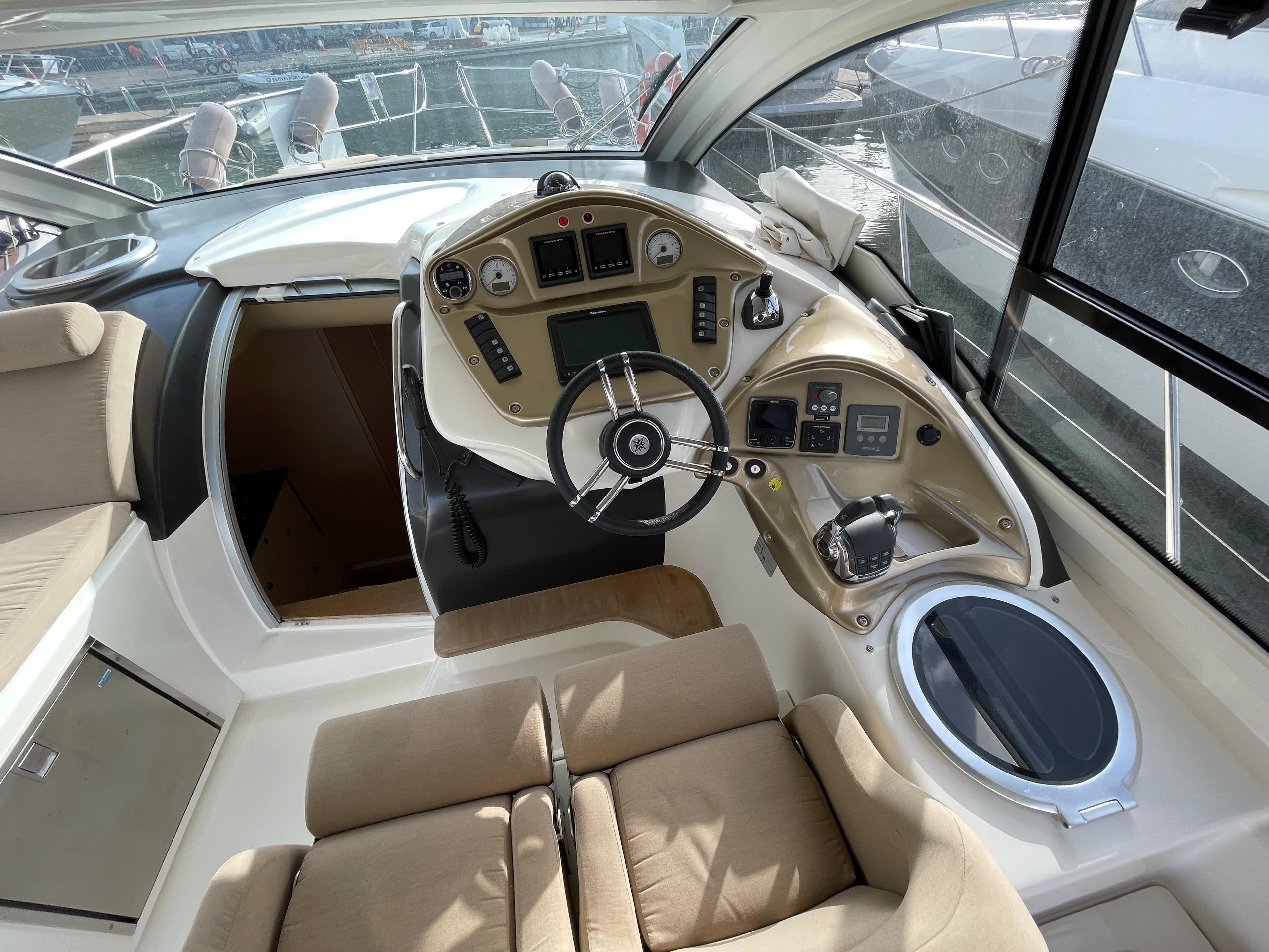 2012 Cranchi M38 yacht cockpit with modern steering and navigation controls.
