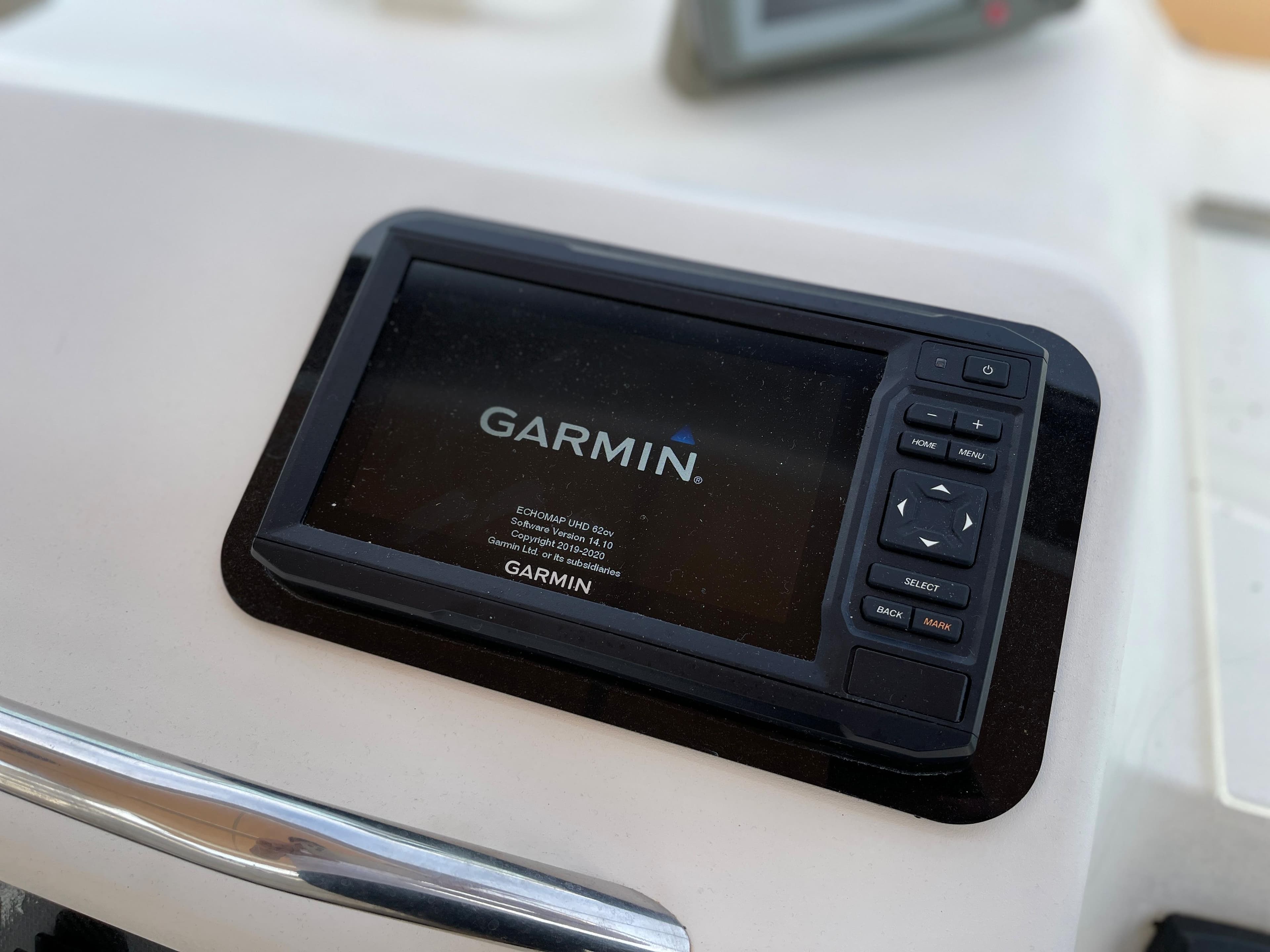 A Garmin navigation device is mounted on a boat.