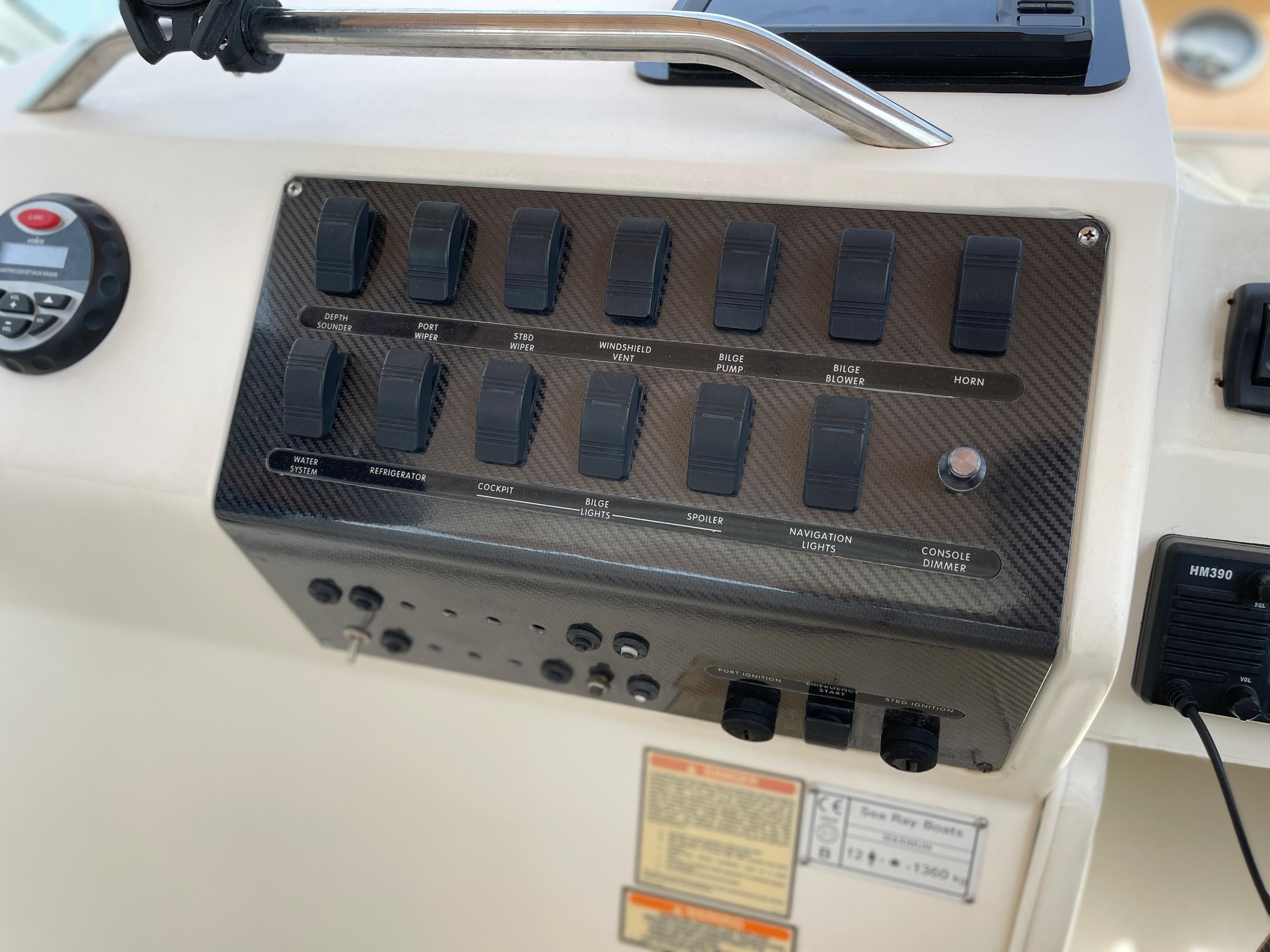 The image shows the dashboard of a 1997 Sea Ray 290 Sundancer with various switches.