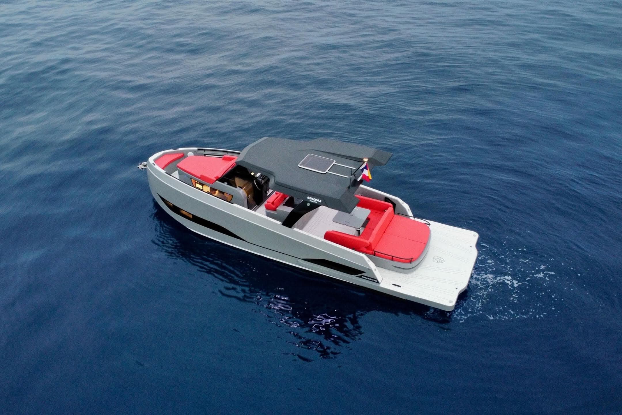 Luxury Kumbra 36 yacht, 2026 model, cruising on open sea with sleek design and red seating.