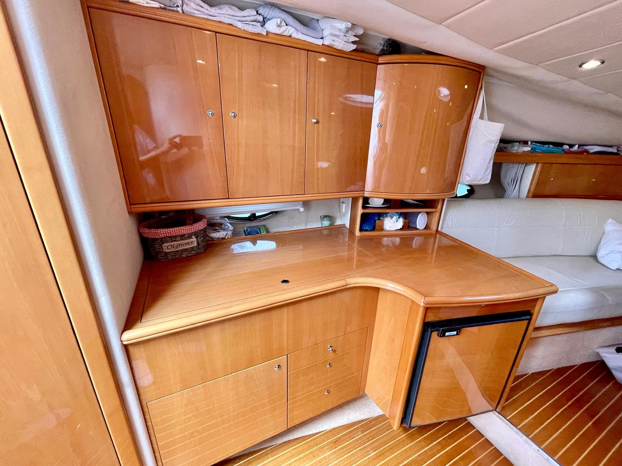 Interior of Windy Bora 40 yacht, wooden cabinetry and seating area, 2003 model.