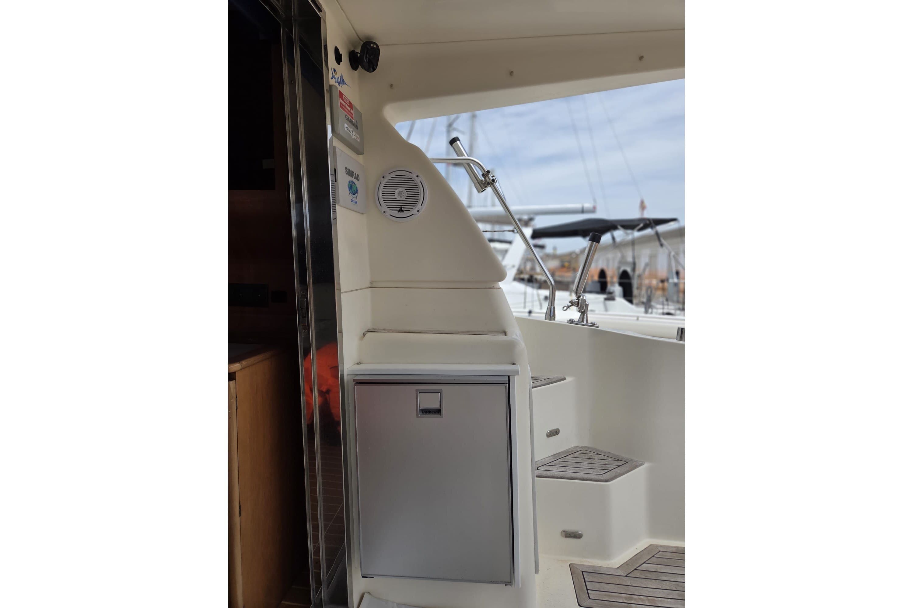Interior view of 1994 Azimut 43 yacht, featuring steps and a compact storage area.
