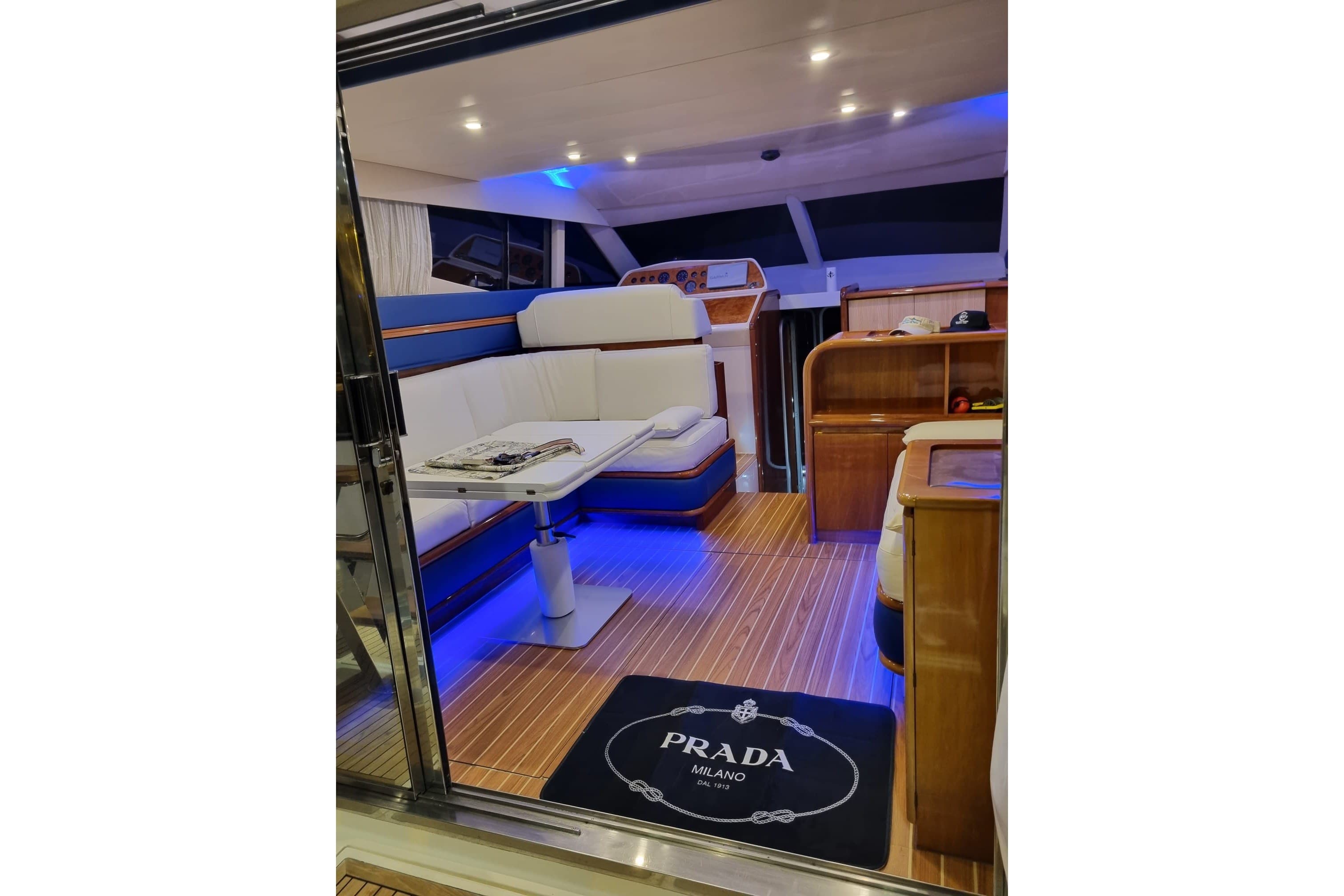 Luxurious interior of a 1994 Azimut 43 yacht with elegant seating and ambient lighting.
