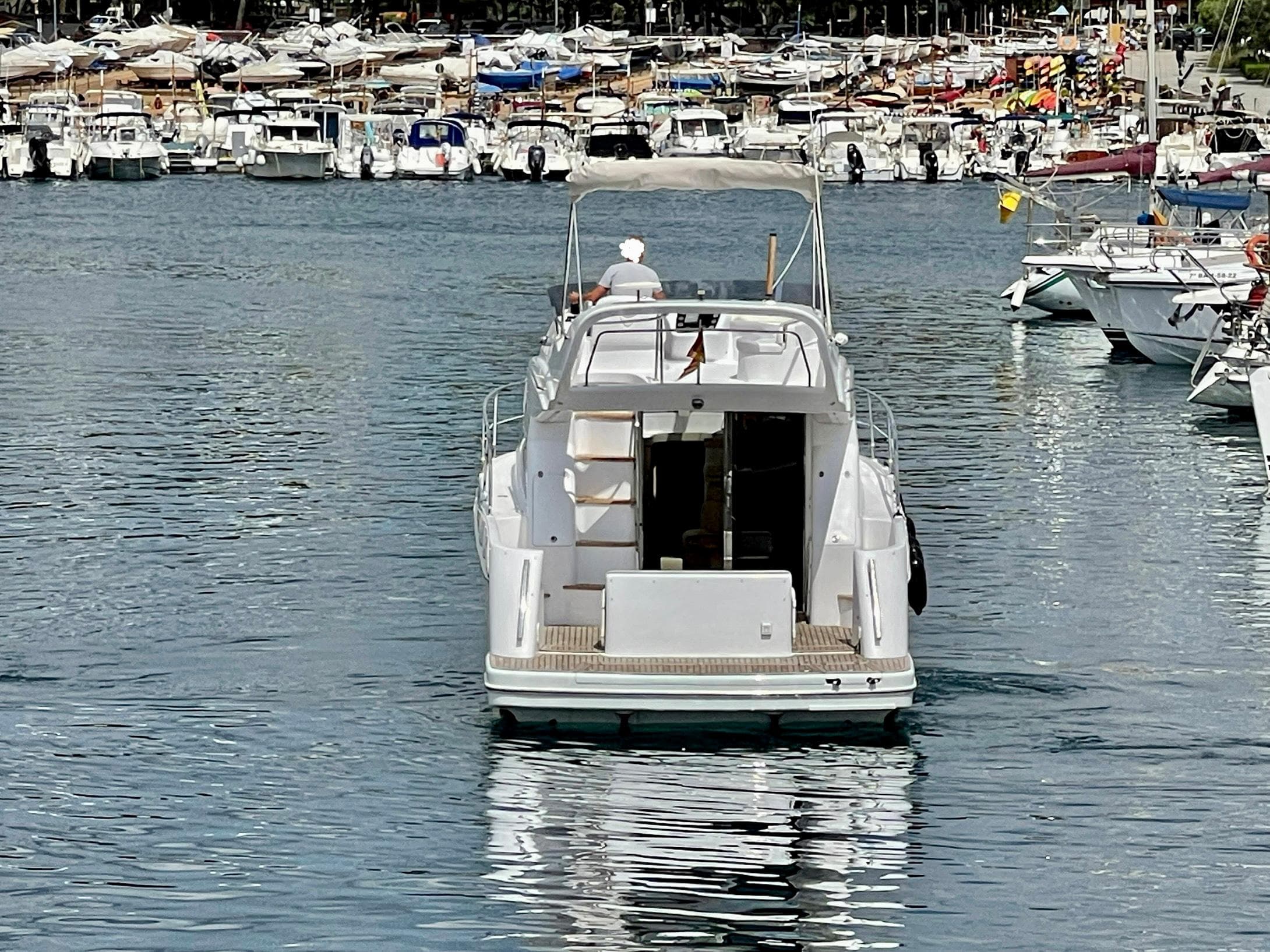 Genesis Boats 37 Flybridge 2006 cruising in a busy marina.