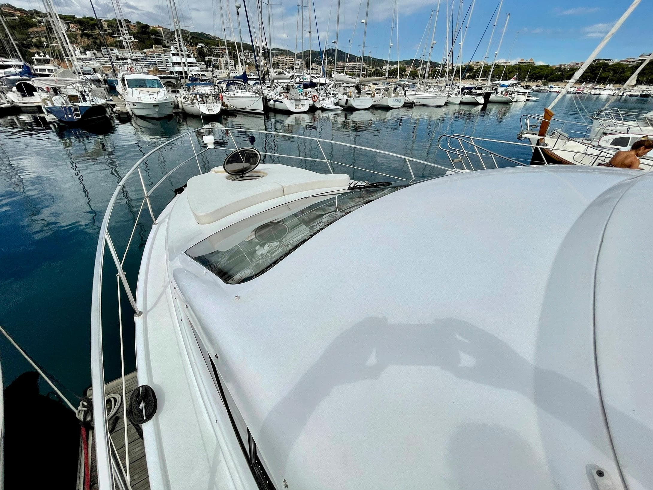 Genesis Boats 37 Flybridge 2006 docked in a marina with other vessels.