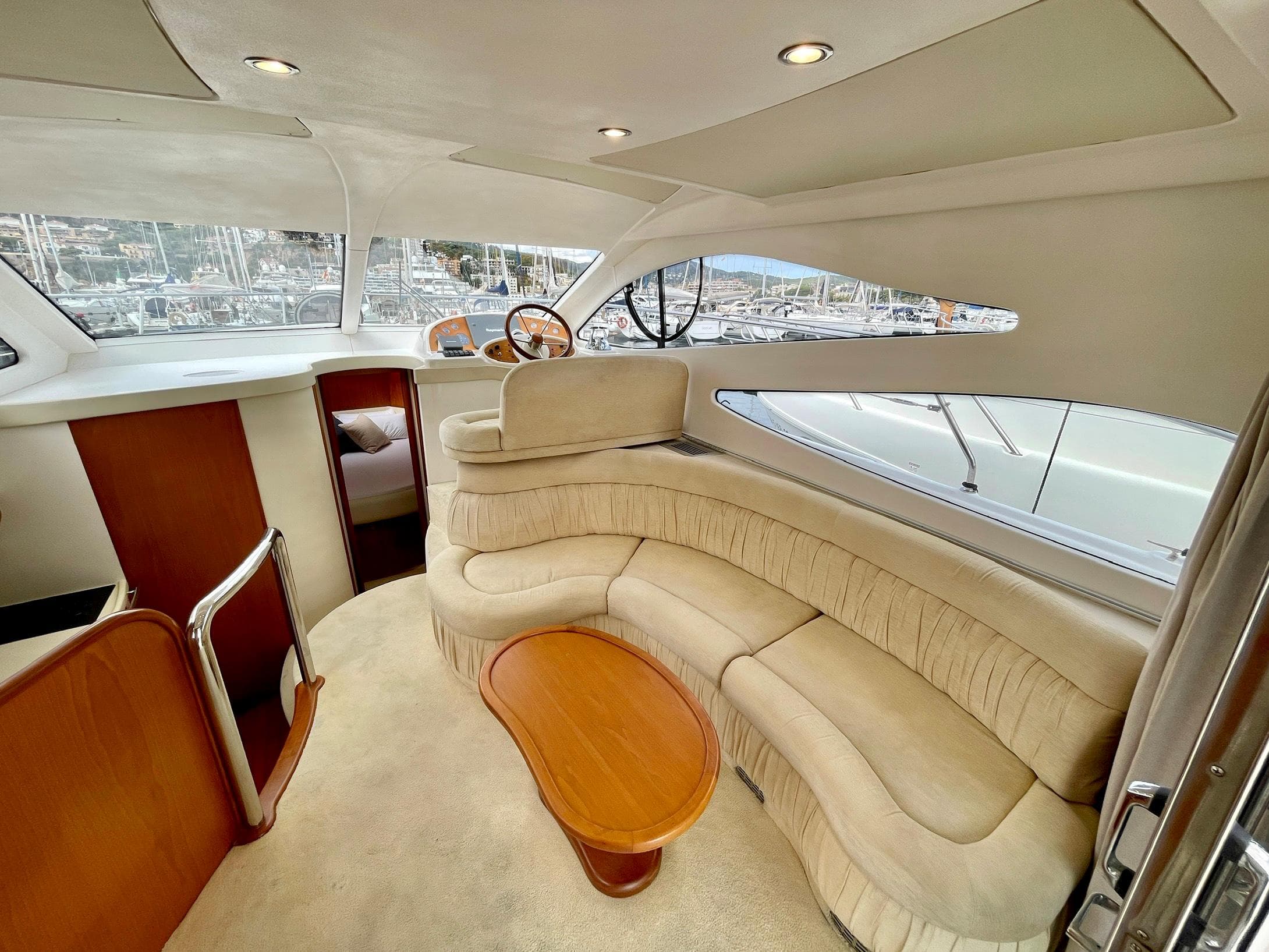 Luxurious interior of 2006 Genesis Boats 37 Flybridge with plush seating and elegant design.