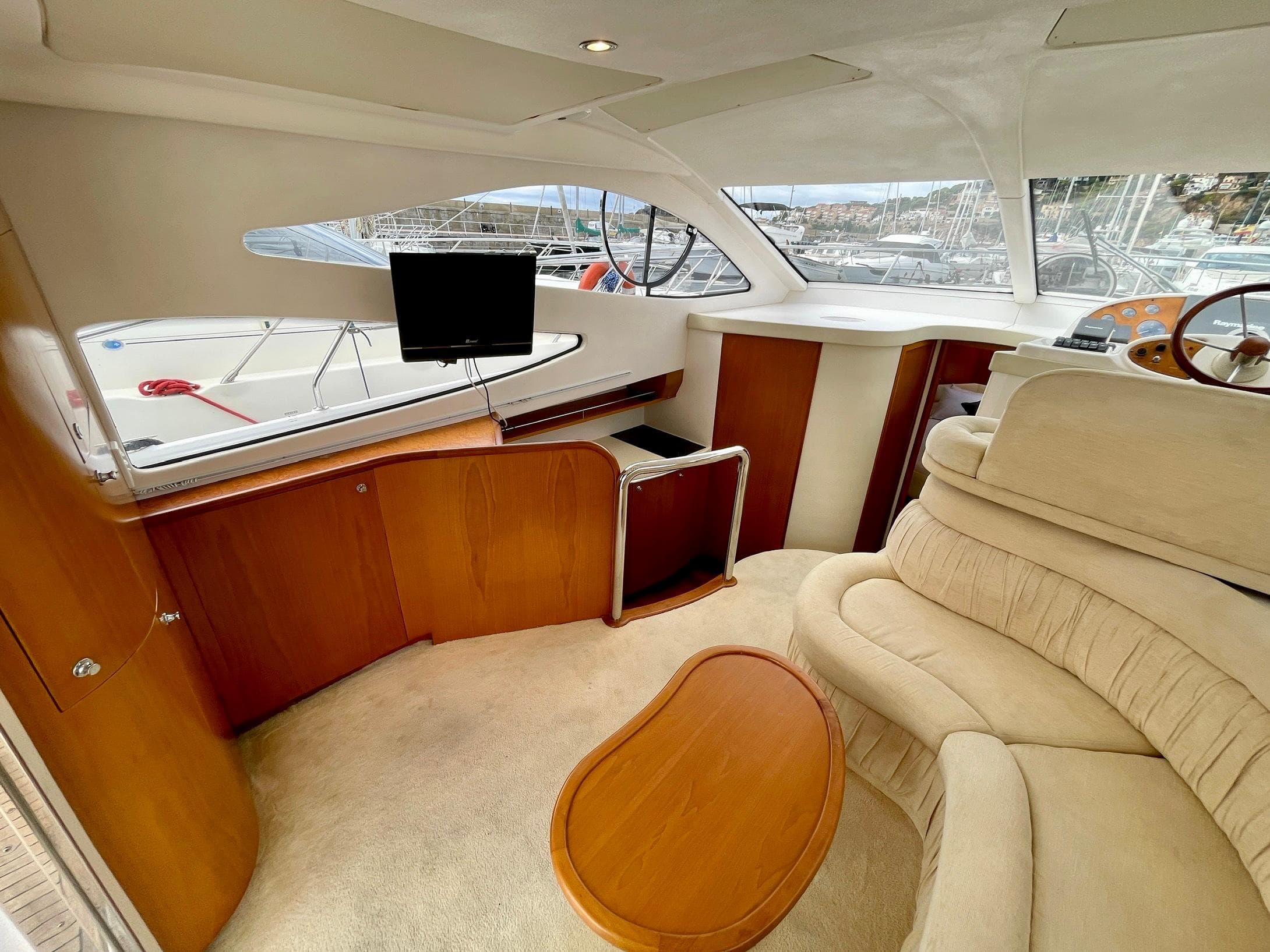 Luxurious interior of 2006 Genesis Boats 37 Flybridge with plush seating and modern amenities.