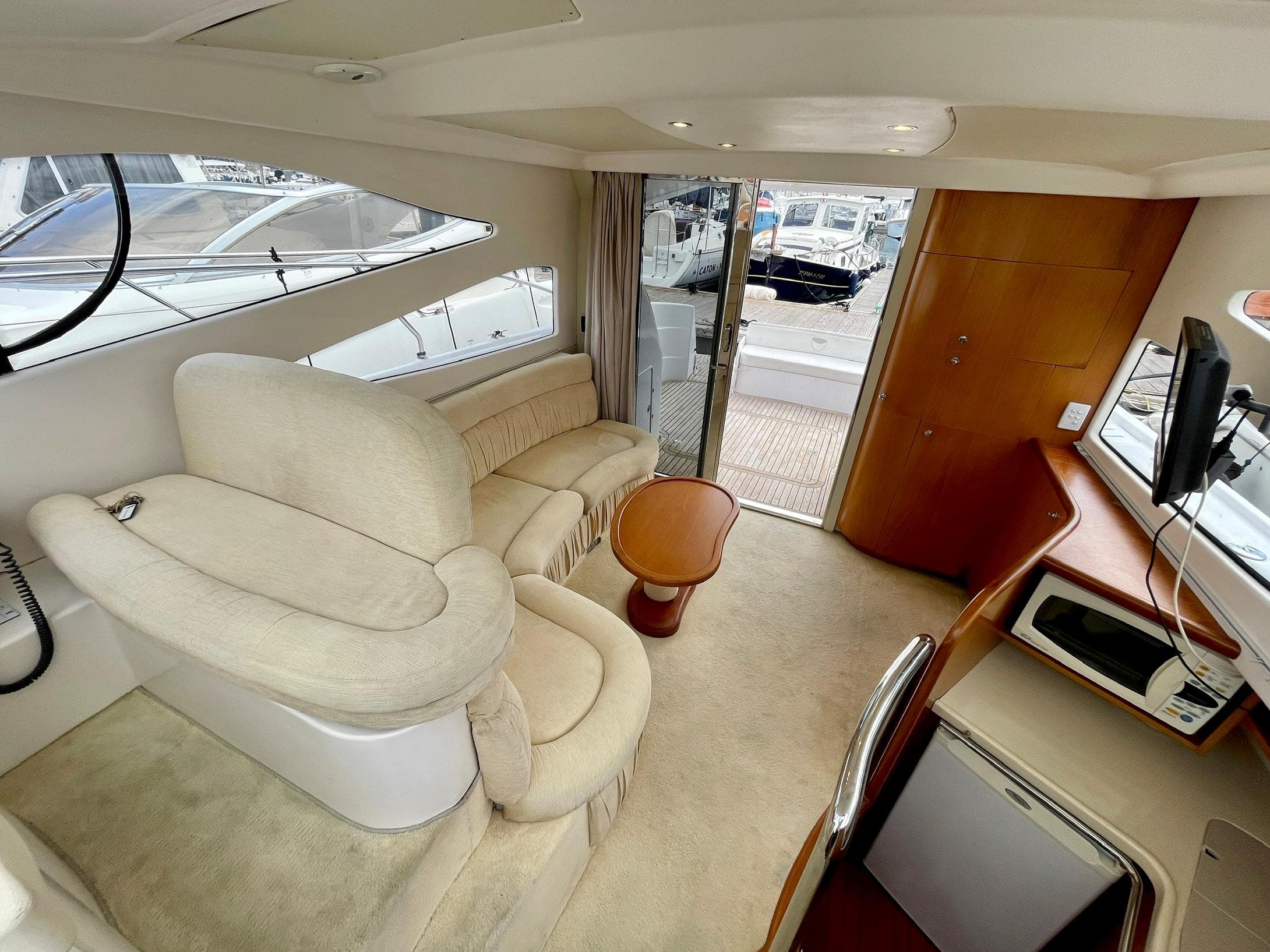 Interior of 2006 Genesis Boats 37 Flybridge with plush seating and modern amenities.
