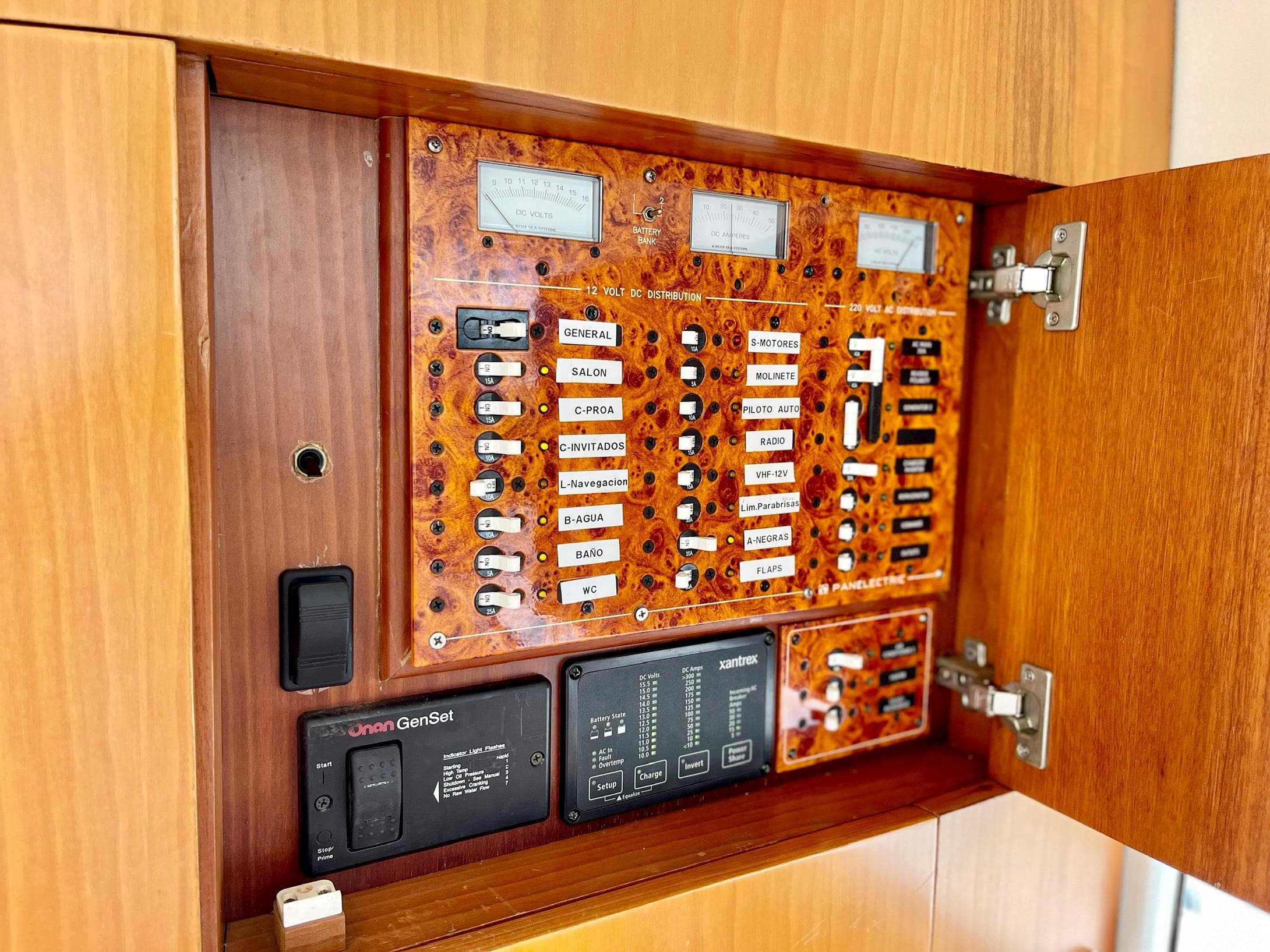 Electrical control panel inside 2006 Genesis Boats 37 Flybridge, featuring labeled switches and meters.