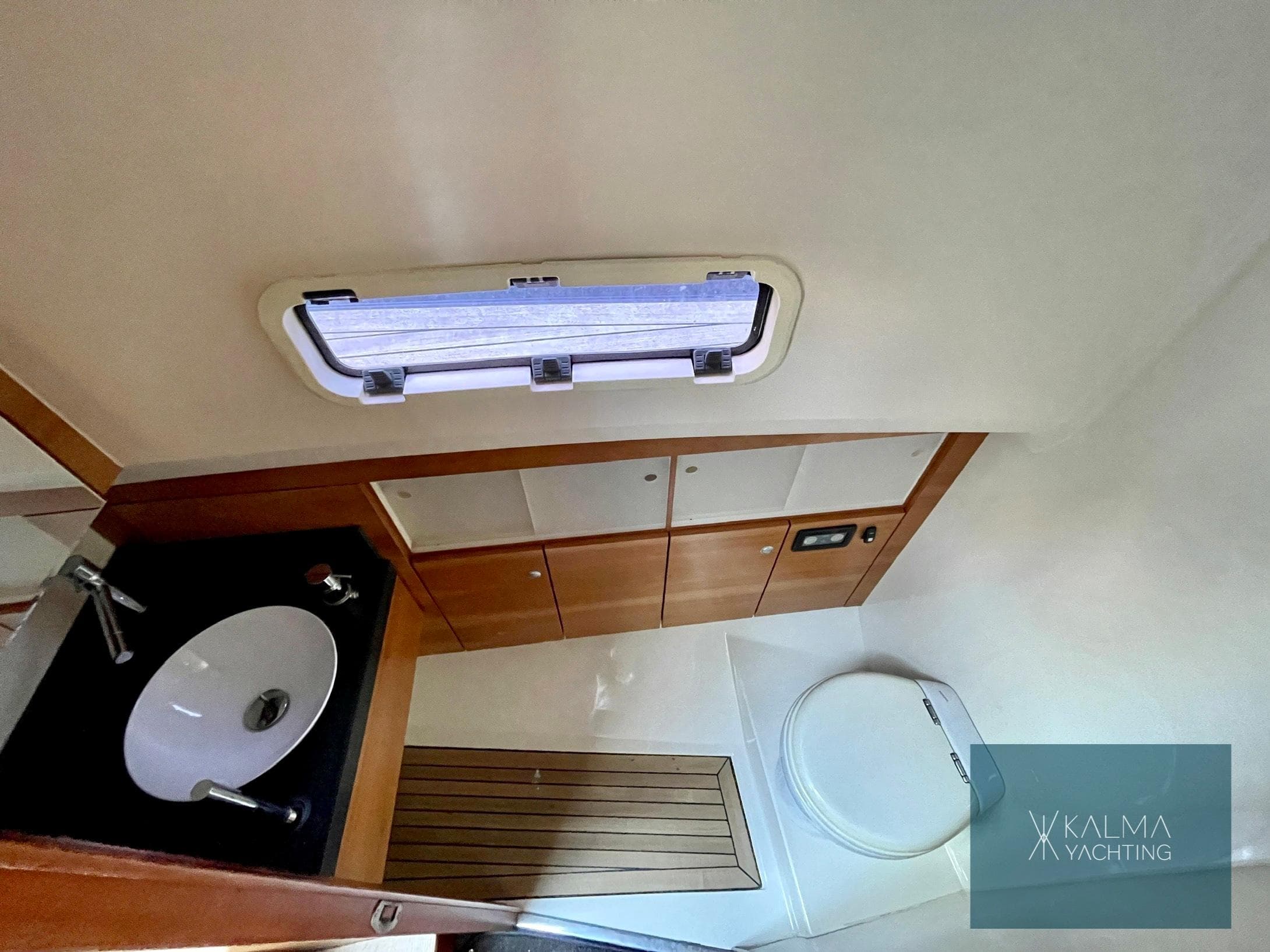 Interior of 2008 Fjord 40 Open with sink and toilet.