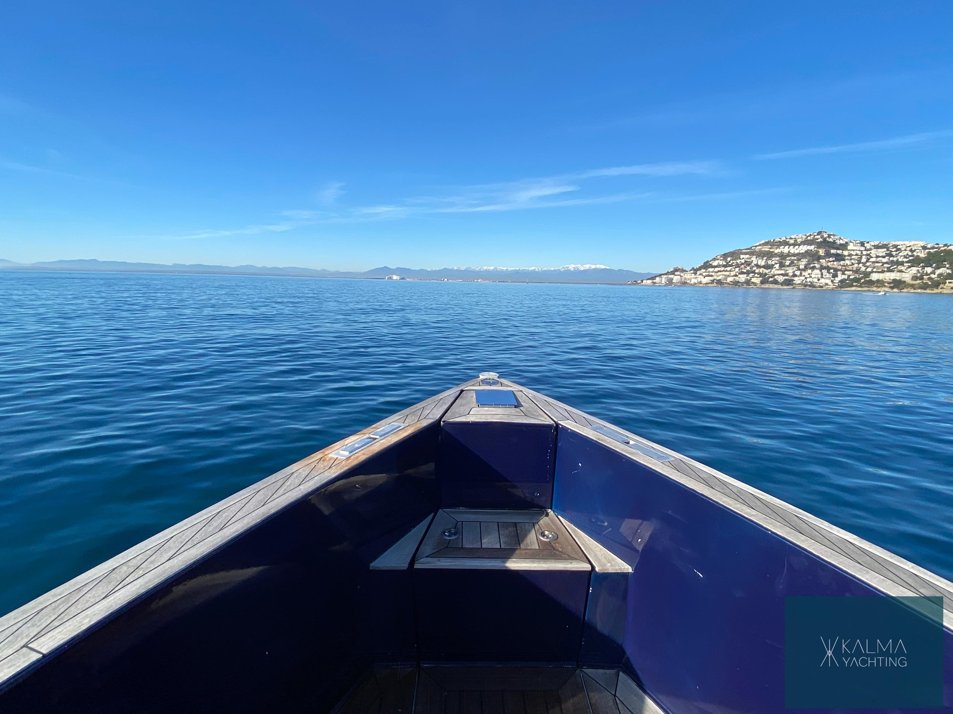 Fjord 40 Open 2008 on calm sea with coastal view.