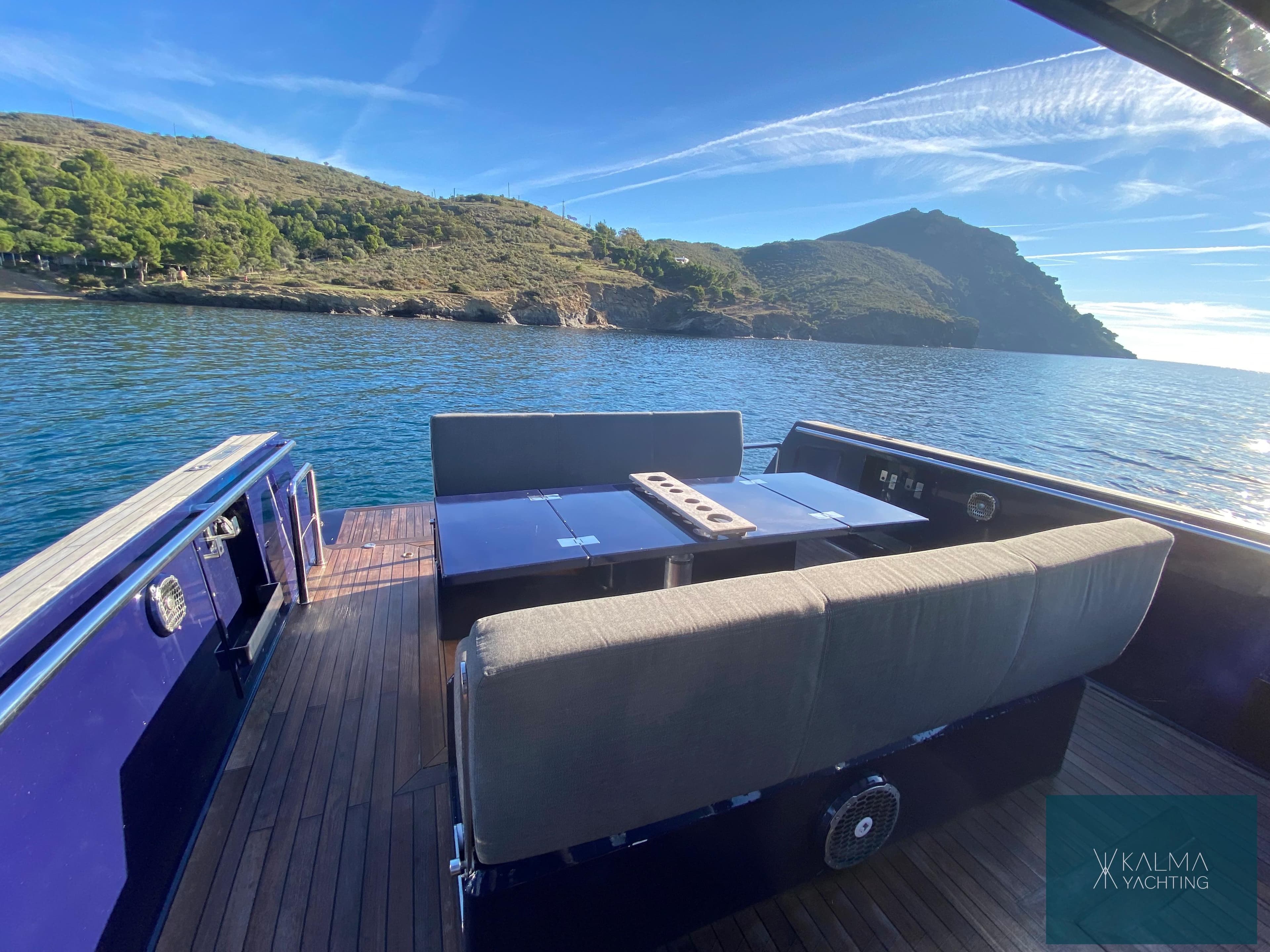 2008 Fjord 40 Open yacht on calm waters with mountain view.