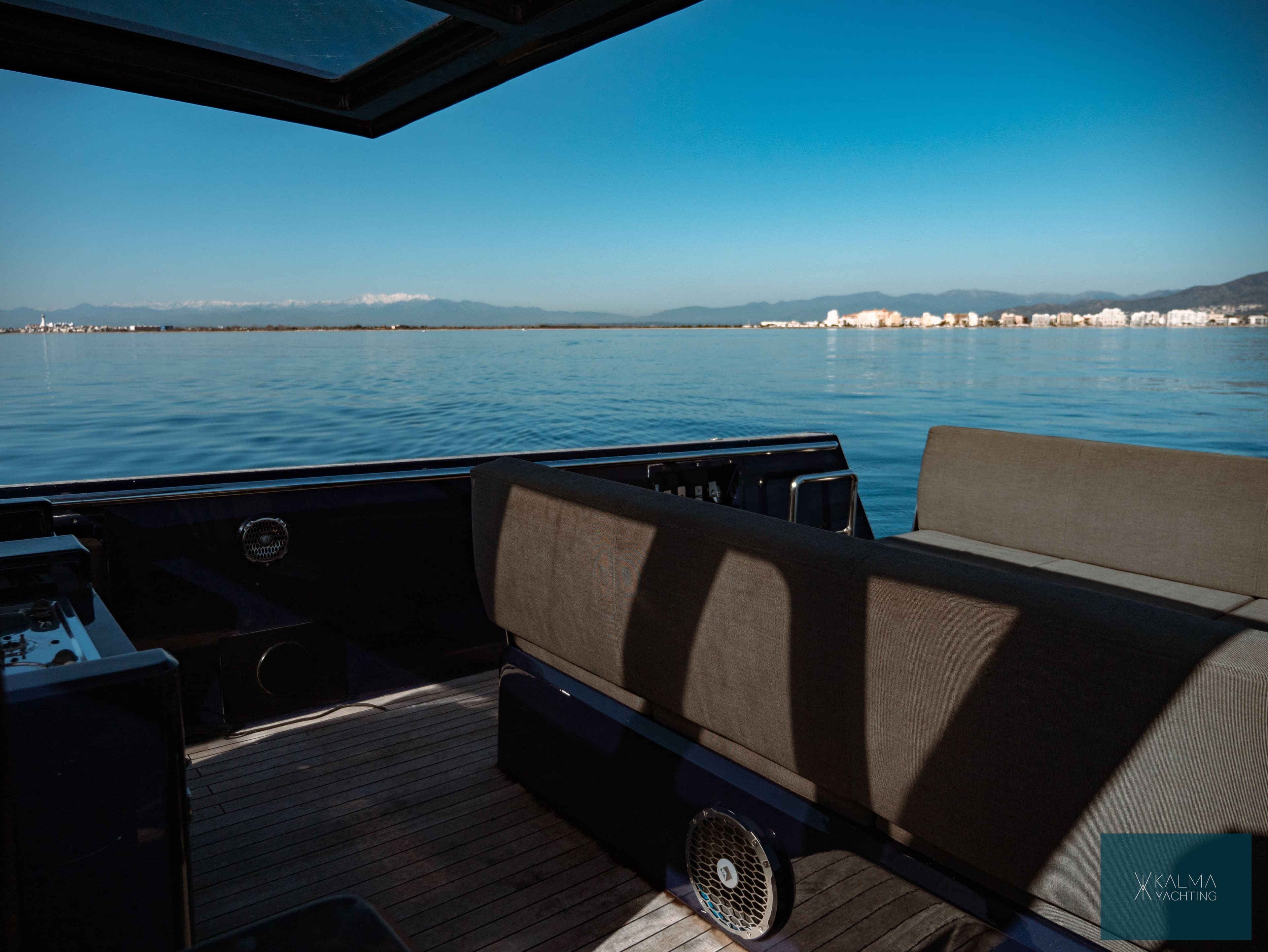 Fjord 40 Open 2008 on calm waters with coastal view.