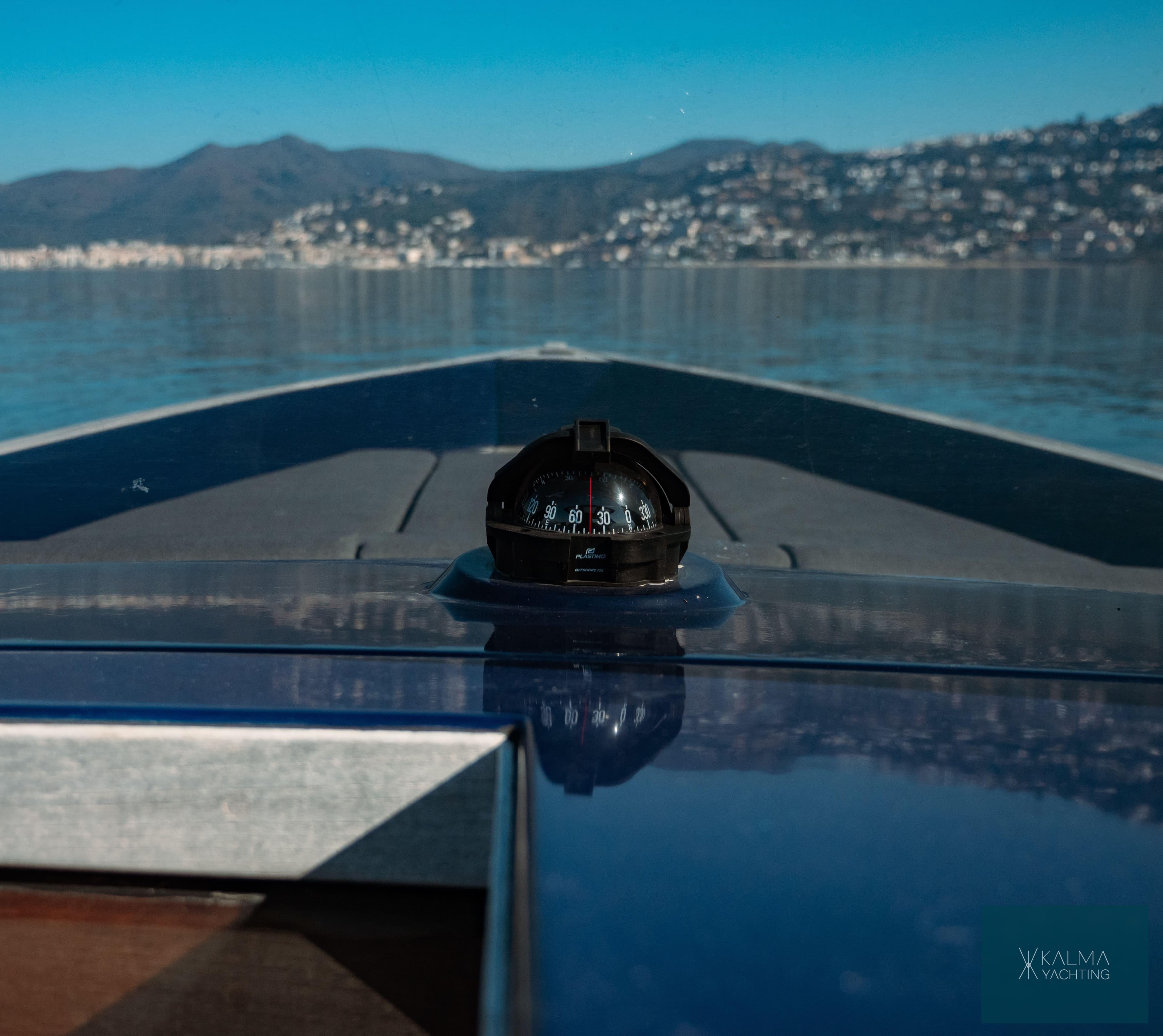 Fjord 40 Open 2008 on calm waters with compass.