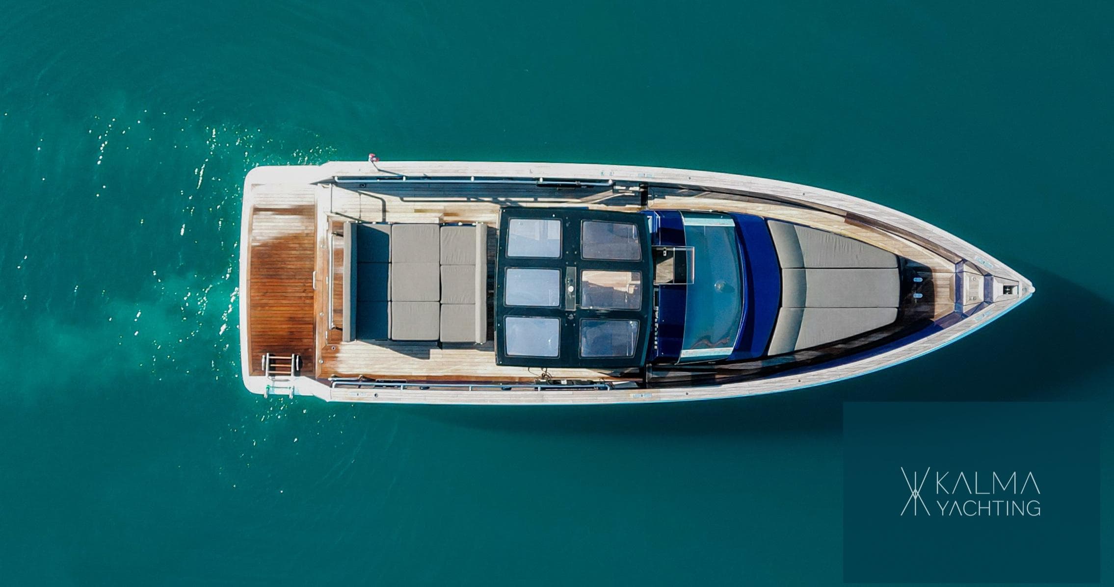 Aerial view of a 2008 Fjord 40 Open yacht on blue water.