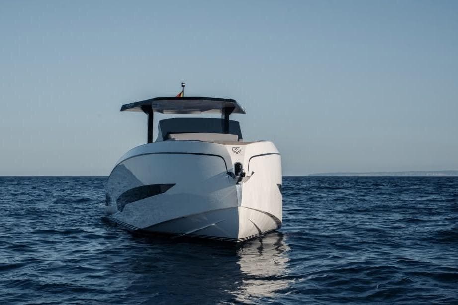 Front view of 2026 Kumbra 36 yacht on open sea under clear sky.