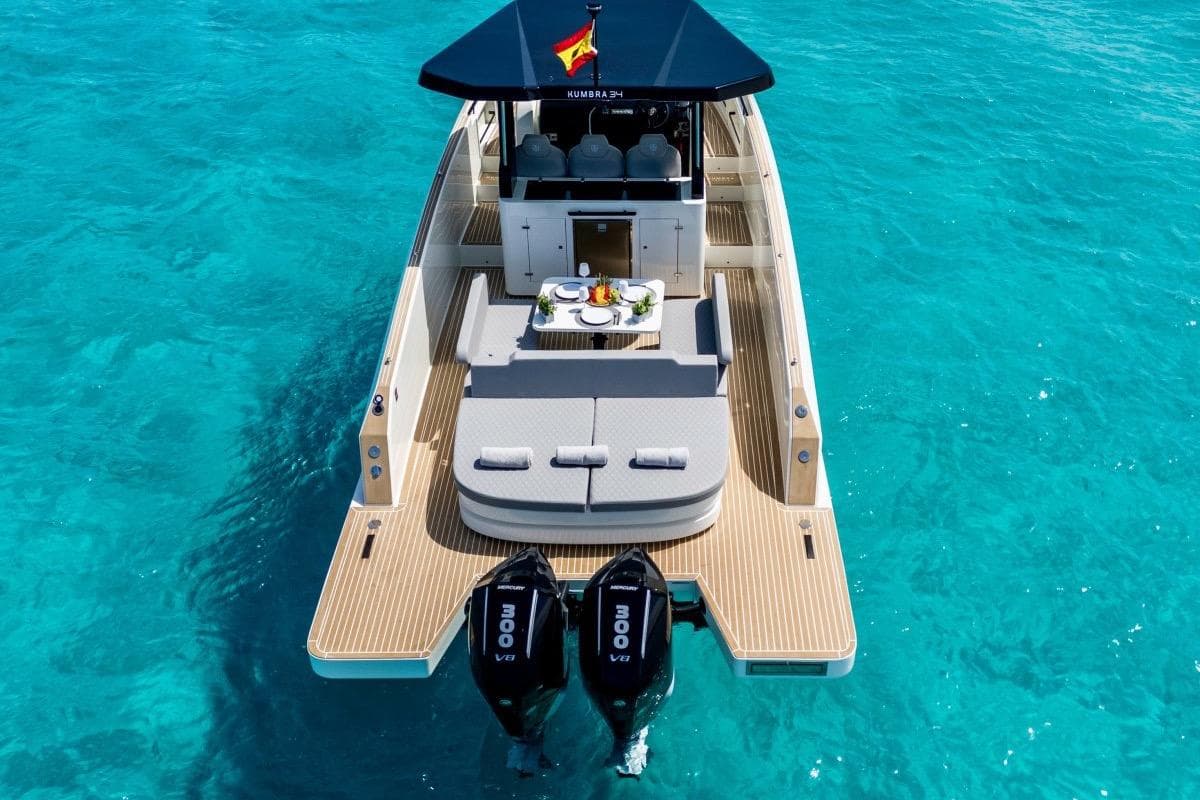 Luxurious 2026 Kumbra 36 yacht on clear turquoise water, featuring elegant deck and seating.