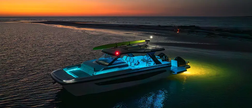 Aquila 45 Sport with its lights on at dusk