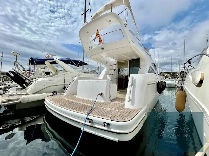 Stern of a flybridge moored in the harbour