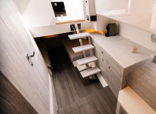 Companionway steps and cabinetry inside the Kumbra 34