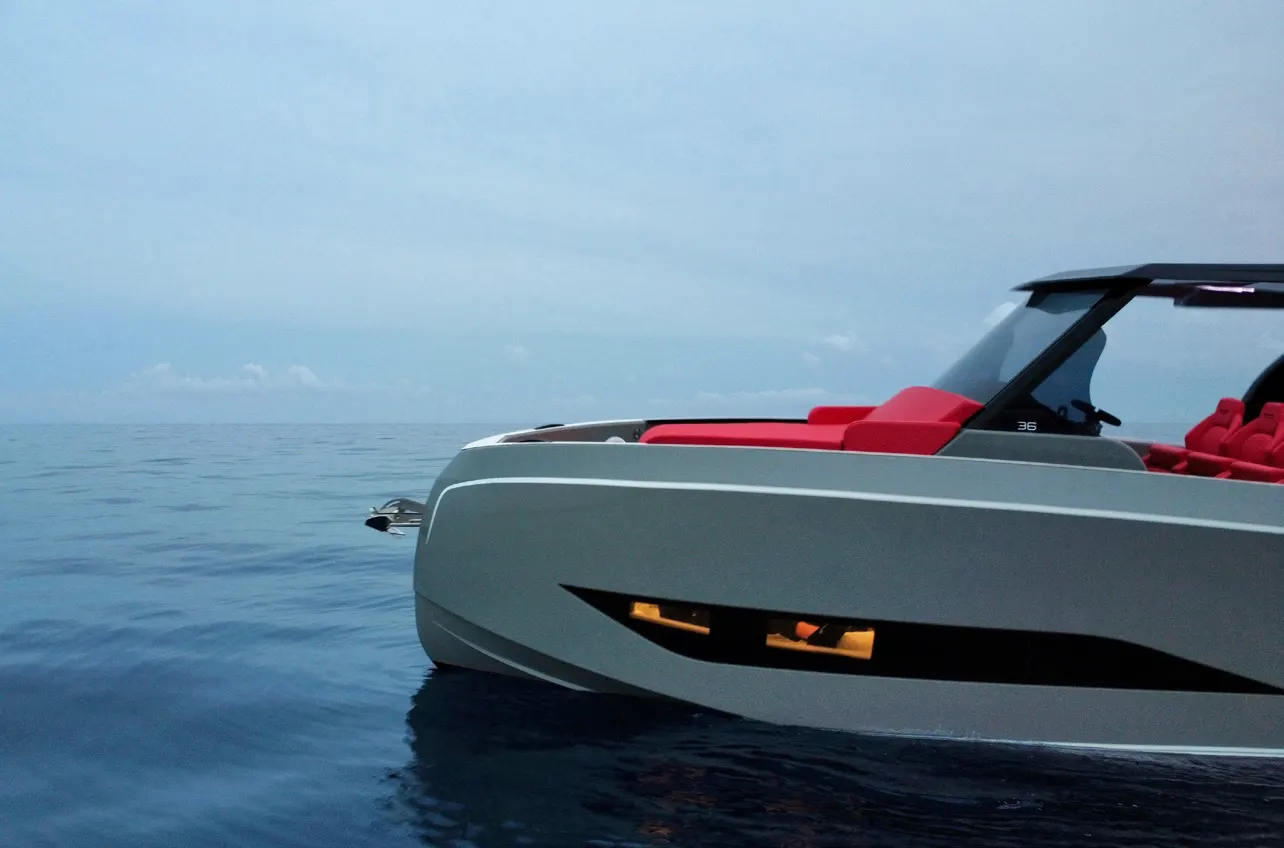 Side of the Kumbra 36 with its hull lights on