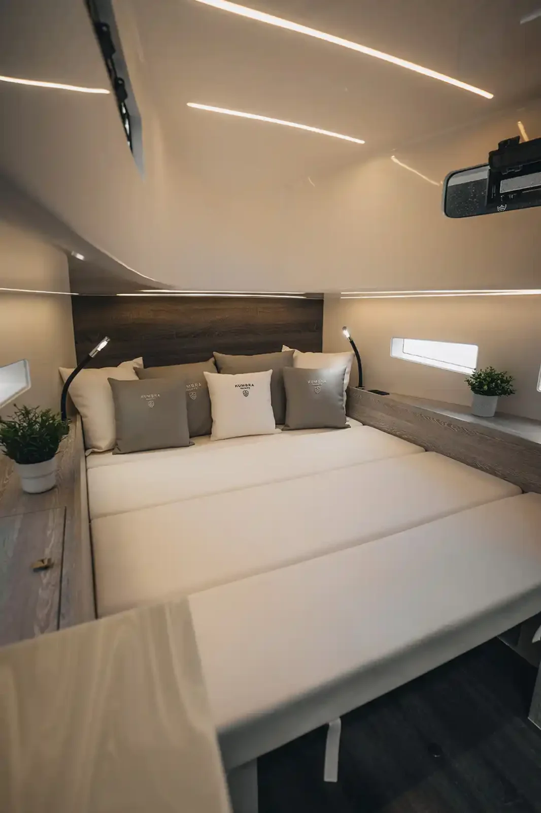 Kumbra cabin with its double bed and branded cushions