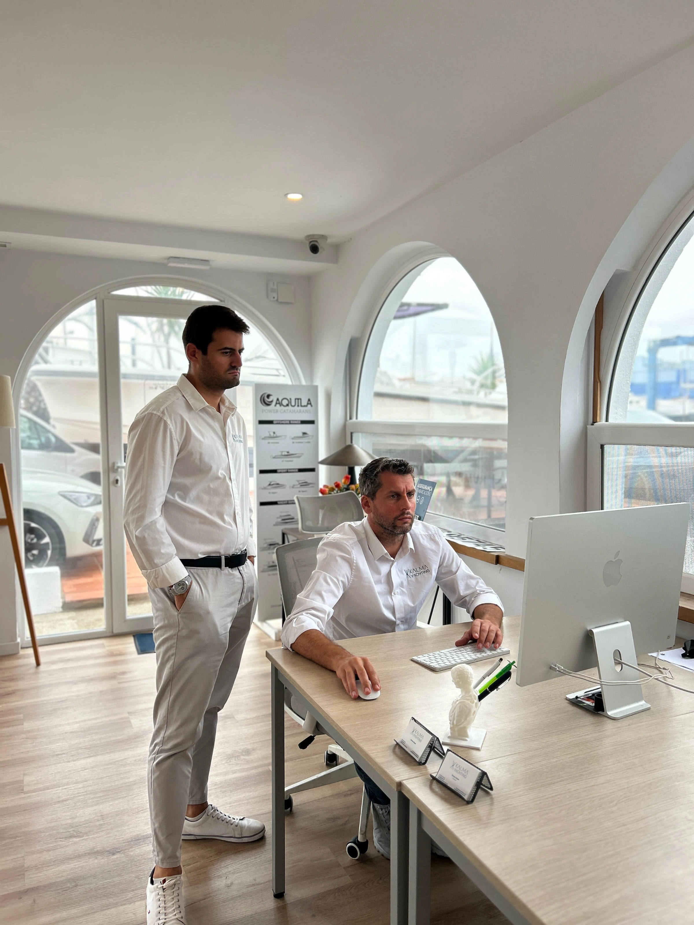 Two team members reviewing a listing at the office