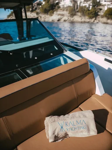 A Kalma Yachting towel on a boat seat